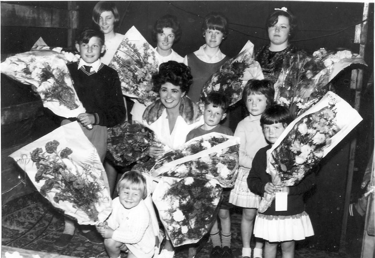 Elsie Tanner with flowers